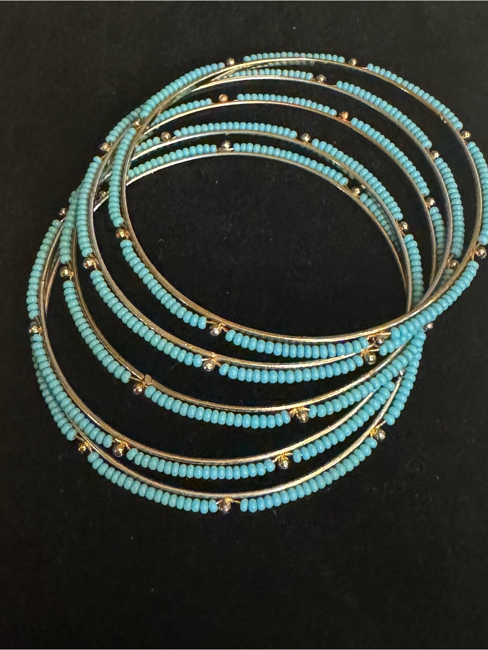 Turquoise and gold tone set of five bangle bracelets!